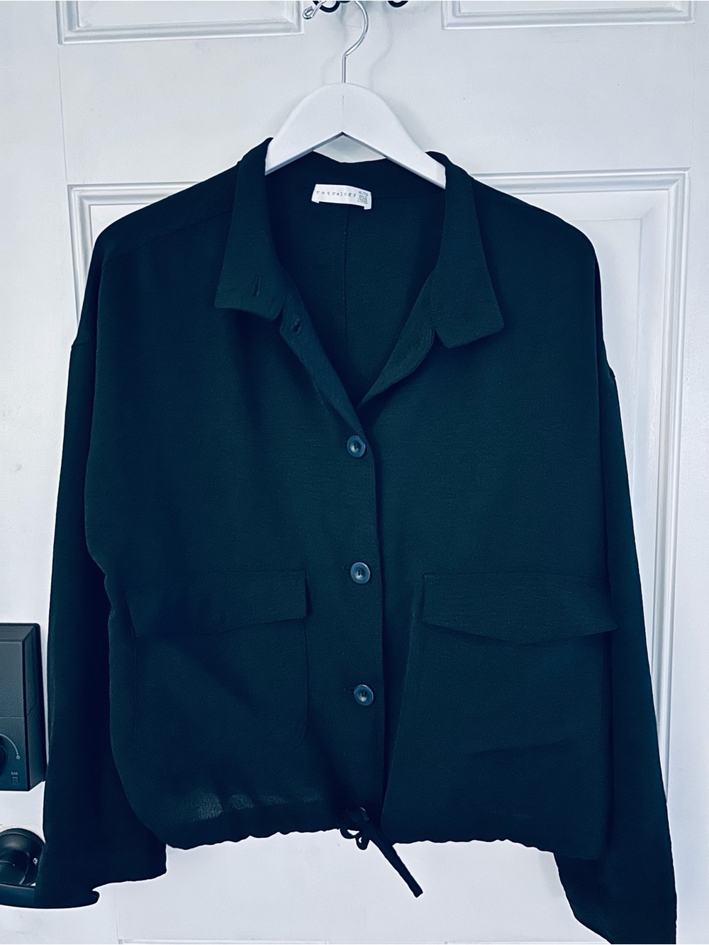 Relaxed Black Button-Front Blouse with Drawcord Hem